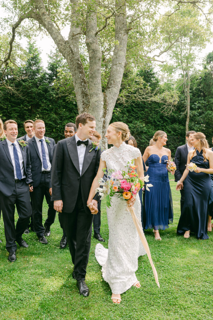 bride and groom walking at Lambert's Cove Inn